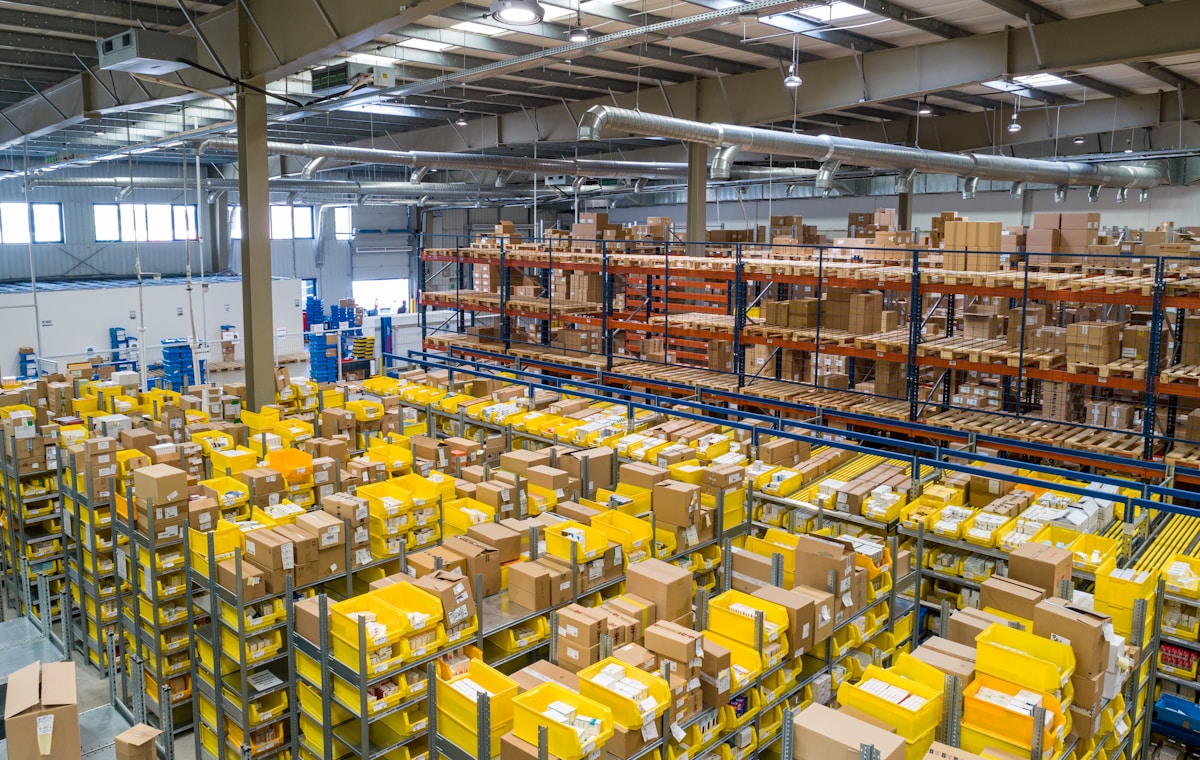 Cartons and unfinished goods ready to enter a managed value-addition workflow
